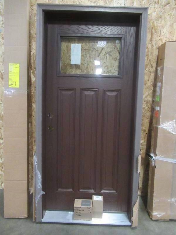 lot 180 image: 3 Panel Craftsman 36 x 80 Wood Exterior Door 14 Lite, In Moorish Teak With Brickmold. Double Bore - Never Installed.