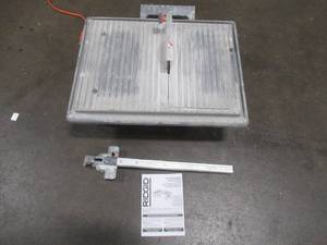 lot 27 image: RIDGID 120-Volt 7 in. Table Top Wet Tile Saw, R4021 - Used. Works well - Missing Pump.