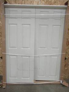 lot 169 image: Jeld-wen Interior French Doors, Approximate Dimensions 61 58 x 77 14 x 4 916, No Bore, No Designated Swing. Hollow Slabs are 30 x 75 916. - Slightly Scratched.