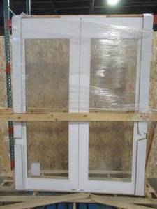 lot 170 image: FeatherRiver Interior Full Lite French Doors, Approximate Dimensions 61 58 x 81 58 x 4 916, No Bore, No Designated Swing. Slabs are 30 x 80. - Slightly Scratched.