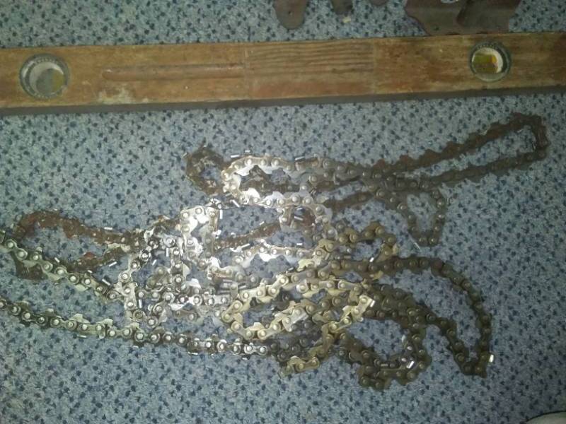 lot 254A image: Miscellaneous tools, chainsaw chains, 4 foot level, NEW 4 light & Coax wall plates.