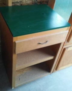 lot 136 image: Oak Base cabinet with green top.