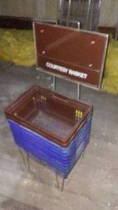 lot 90 image: Plastic Hand-Held Shopping Baskets with StandRack.