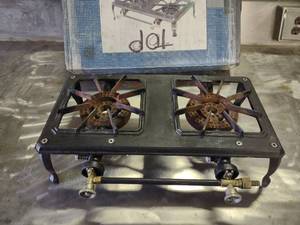 lot 11 image: Two Burner Cast Iron LP Gas Stove, ...