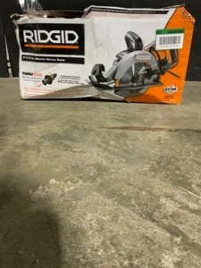 lot 19 image: RIDGID THRUCOOL 15 Amp 7-14 in. Worm Drive Circular Saw. See Pictures