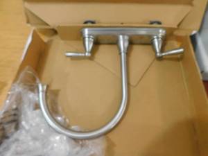 lot 26 image: Project Source Brice Stainless Steel 2-Handle Deck-Mount High-Arc Handle Kitchen Faucet (Deck Plate Included)