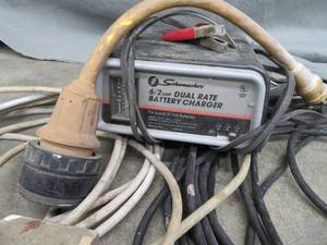 lot 15 image: VINTAGE BATTERY CHARGER, ADAPTOR CORD 240 EXTENSION CORDS.