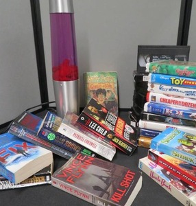 lot 19 image: MUREDER MYSTERY BOOKS  LAVA LAMP  VINTAGE VHS