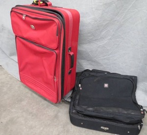lot 69 image: LARGE RED SUITCASE  SUIT BAG