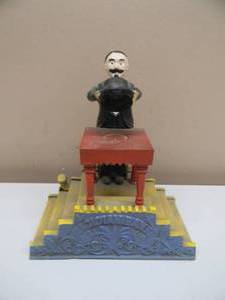 lot 27 image: VINTAGE Magician MECHANICAL CAST IRON BANK - NICE - DISAPPEARING COIN TRICK - SEE PICTURES