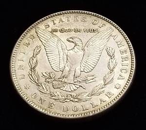 1886 MORGAN SILVER DOLLAR AU