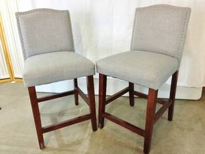 MSRP $300 Pair Skyline Imports&nbspCamelot Nailhead Trim Grey Linen Fabric Upholstered Seat &amp Back Counter Height Barstools On Mahogany Wood Finish Legs WFoot Rests - Great Pre-owned Condition 1st Pic Is A Stock Pic - Rest Are Actual Chairs&nbsp