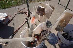 lot 49 image: Large Lot of Ice Fishing Tip Ups, Ice Rods and Ice Scoops