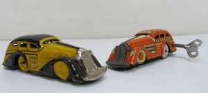 lot 38 image: 2 Vintage Tin Litho Marx TRICKY TAXI Wind-Up Cars