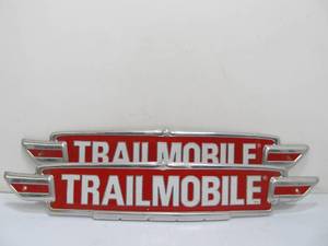 lot 285 image: Embossed Metal TRAILMOBILE Semi Trailers Advertising Signs