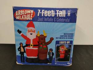 lot 9 image: Airborne Inflatable Santa and Reindeer Yard Art