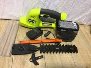 lot 81 image: RYOBI ONE 18V Cordless Battery Grass Shrubber Trimmer with 1.5 Ah Battery and Charger&nbspCustomer Returns See Pictures