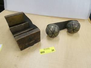 Vintage brass bells on a leather strap, and vintage metal and wood drawer