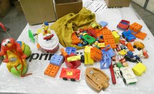 A bunch of toys - elmo, playmobil people and vehicles and a large box full of old wood blocks