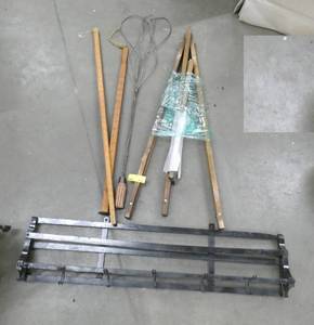 Group of primitive items, coat and hat rack, yard sticks, rug beater and an easel