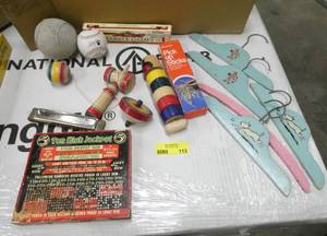 A very old baseball and a new Tony the tiger ball, a harmonica, some old fashioned games and some cute hangers