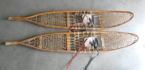 A pair of Bentley Wilson wood and leather snow shoes with an accurate picture