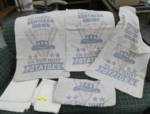 4 Red River potato bags and 2 plain bags