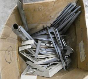 Box with a whole bunch of garage support brackets for shelving