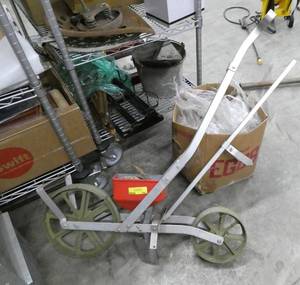 Walk behind seeder, includes multiple discs for different seed