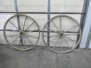 2 large wooden wheels 47 tall