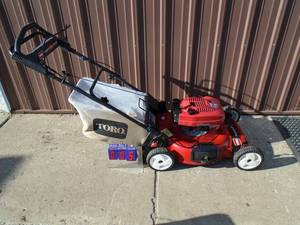 Toro personal pace lawn mower with bagger. Used condition. Tested & works. As shown.