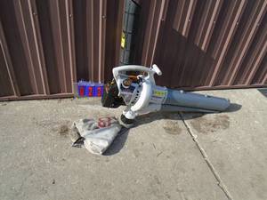 Ryobi blowervac with bag & tube. Used condition. Tested & works. As shown.