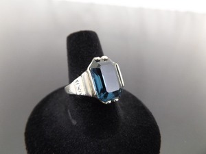 lot 33 image: .925 Sterling Silver Emerald Cut Sapphire Crystal Ring Size 8