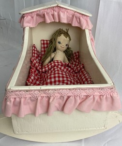 lot 135 image: Vintage Wood Doll Cradle with Cloth Doll, Rattles and Toys