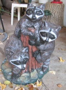 lot 12 image: Cement racoon yard ornament. 20 inc...