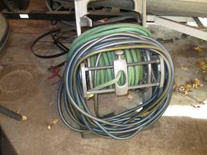 lot 44 image: Large hose reel with 3 total hoses,...