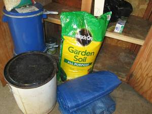 lot 71 image: Metal cans with thistle seed and ot...