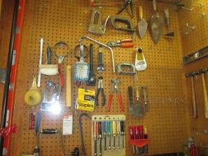 lot 120 image: Tools galore Everything hanging o...