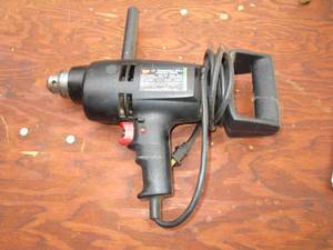 lot 131 image: 12 Reversible variable speed Dril...