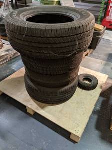 4 tires with various tread includes...