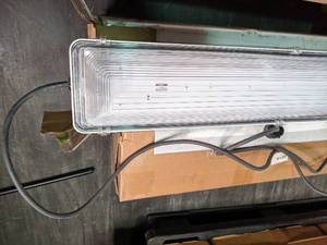 2 sealed 8 light fixtures with 4 ...