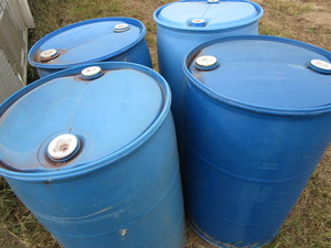 lot 23 image: Blue 55 gallon barrels, qty 4...