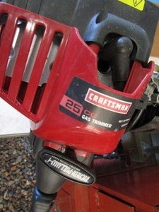 lot 193 image: Craftsman gas trimmer with wheel ty...