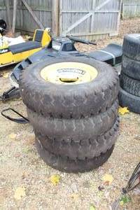 lot 276 image: 7.50-16LT Skid Loader Tires on 8-lug Rims