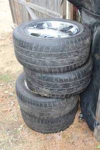 lot 278 image: Firestone Wide Oval P24550R16 97W Tires on ABS 16 Rims for Pontiac