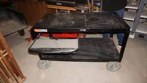Luxor Black Metal Cart With Nice Wheels That Lock In Place.  Plug In Attached To It  With A Slide Out Shelf For Keyboard