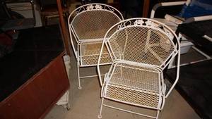 Two White Metal Outdoor Chairs