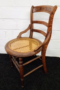 lot 23 image: Curved Antique Ladder Back Chair with Cane Seat