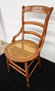 lot 24 image: Curved Antique Ladder Back Chair with Cane Seat