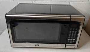 lot 153 image: Oster 1.1 Cu. Ft. 1000-Watt Countertop Microwave Oven with Stainless Steel Front